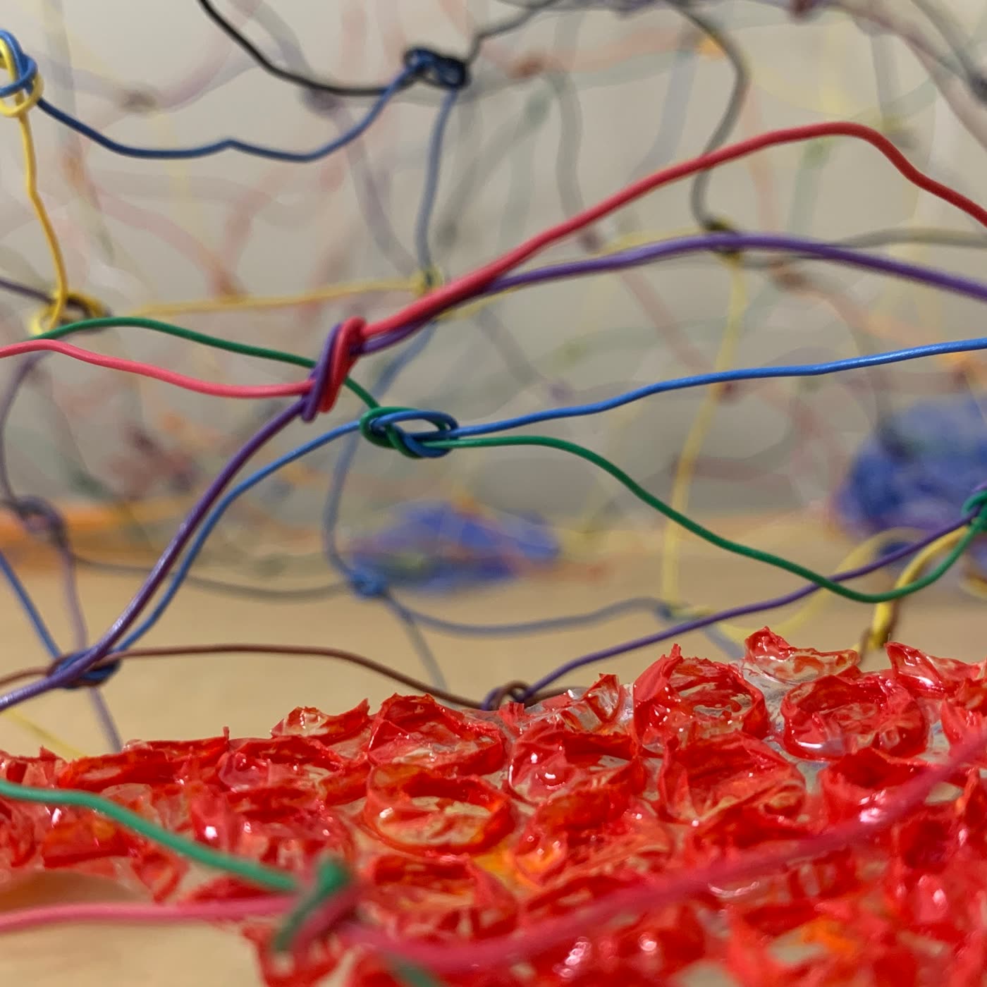 Wire sculpture, red resin center